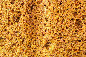 Close detailed macro view of wholesome whole grain bread texture showing the po, a Food & Drink Photo by Eugene_Photo