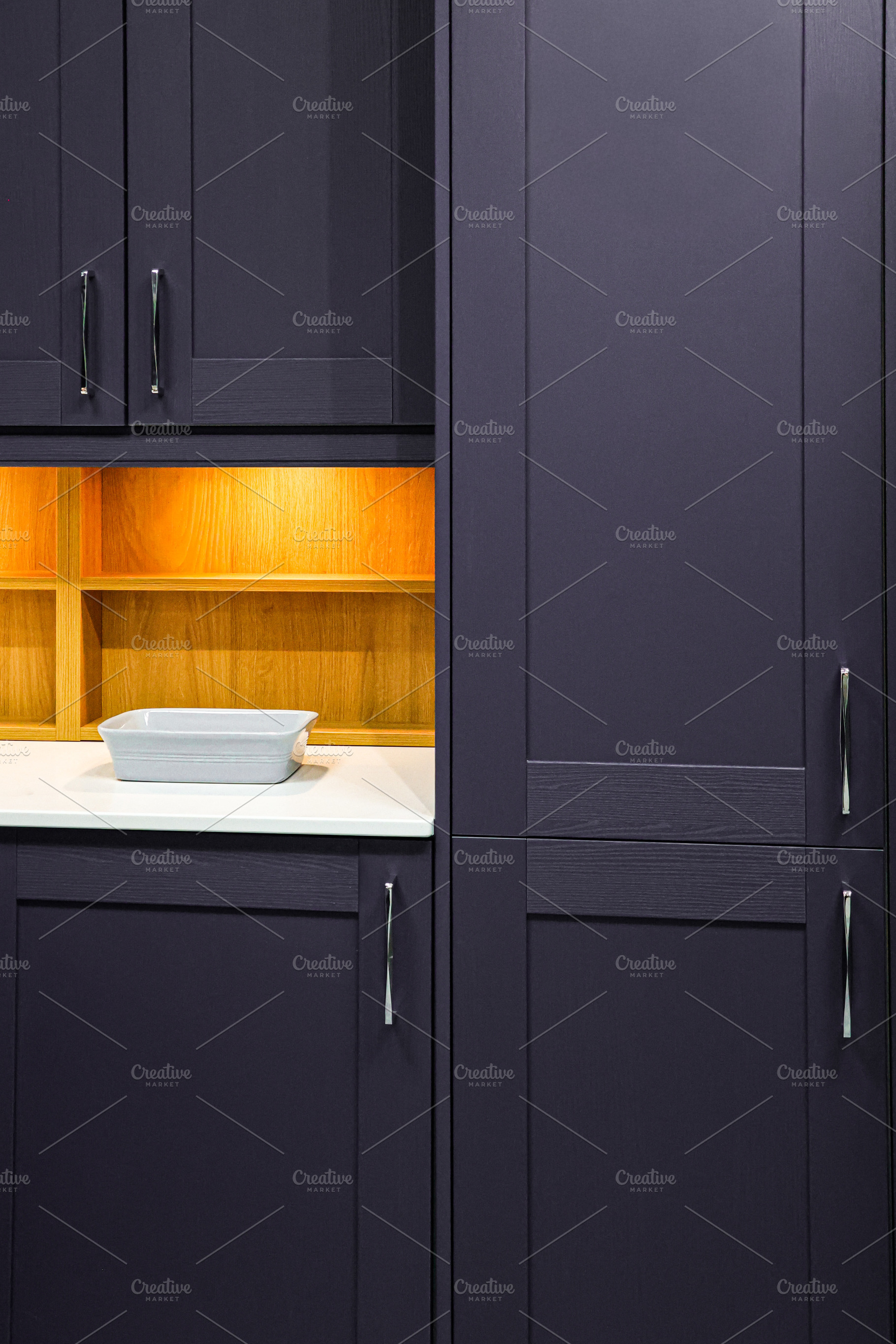 Modern kitchen interior design featuring purple shaker cabinets, white countert, a Photo by Studio ANNA