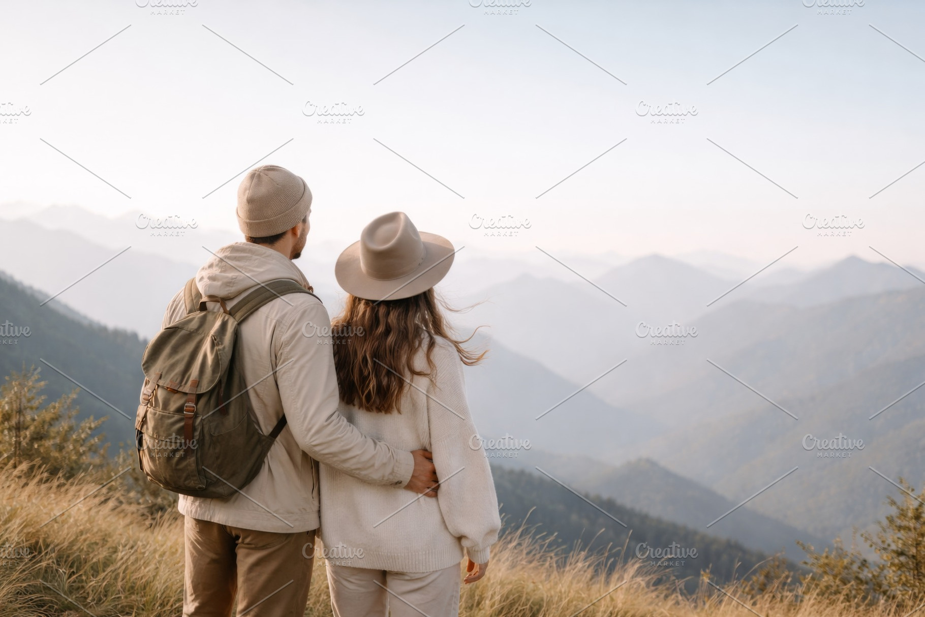Couple on a mountain overlooking sce, a Photo by Dvoevnore photos