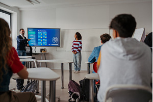 Teen girl presenting AI learning, a School & Education Photo by HalfPoint