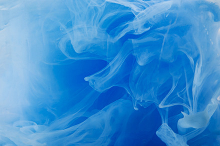 Blue clouds of ink in liquid isolated on white, an Abstract Photo by eleana