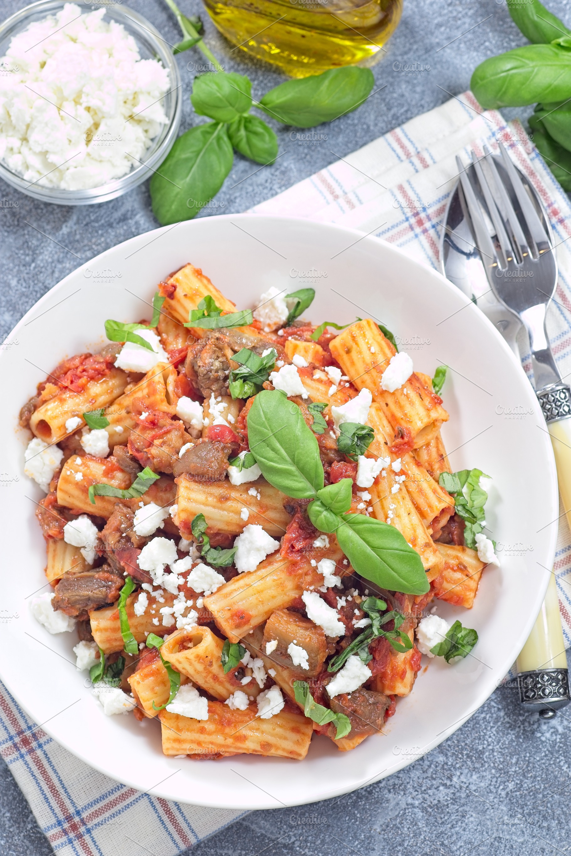 Rigatoni alla Norma pasta with eggplant, tomato, basil and ricotta salata, vert, a Food & Drink Photo by iuliia_n