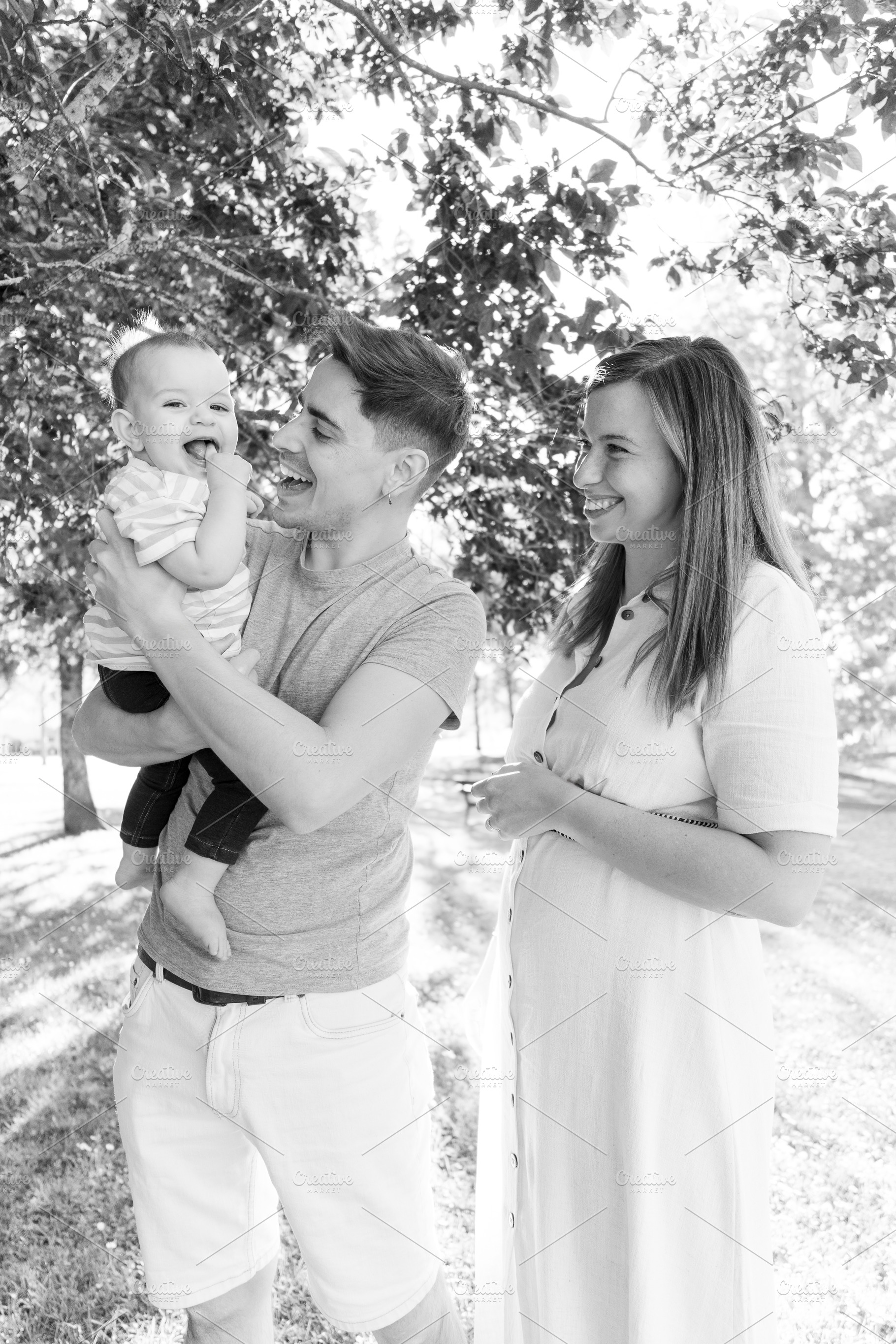 Portrait of a young family with their nine month old baby, a Person Photo by rubenchase