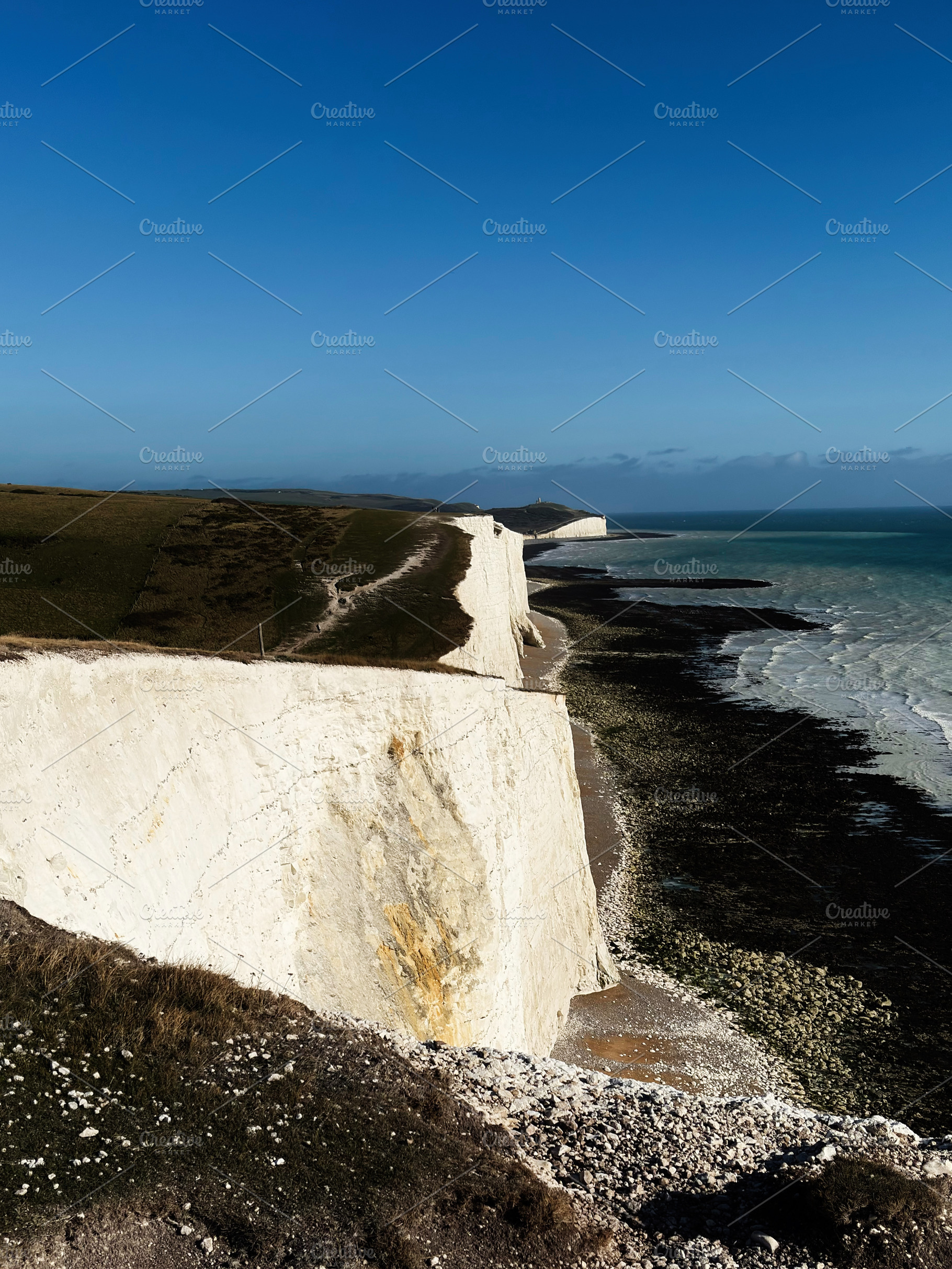 Cliffs along the Seven Sisters coastline in East Sussex with white chalk format, a Nature Photo by AS photostudio