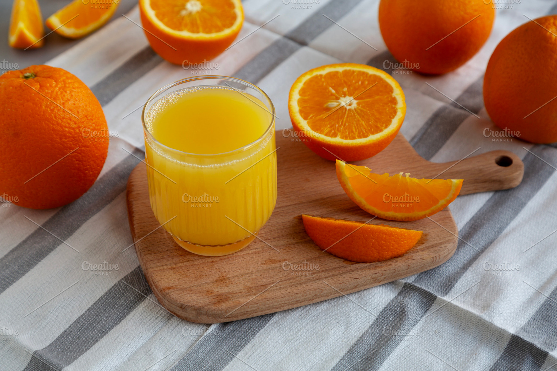 Organic Orange Juice in a Glass, side view., a Food & Drink Photo by LiudmylaChuhunova