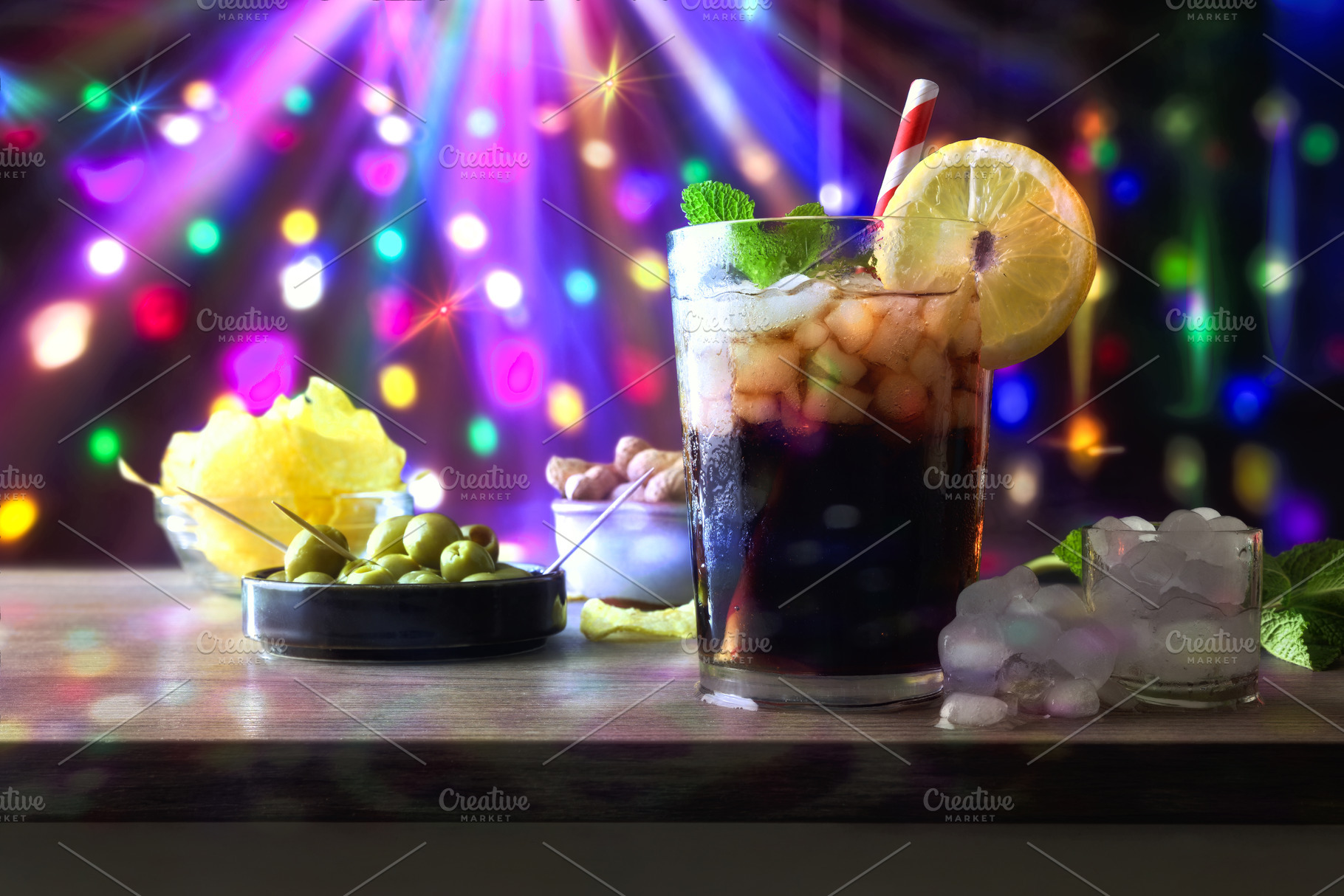 Drink and snacks with a disco background with colored lights, a Food & Drink Photo by Davizro's Market