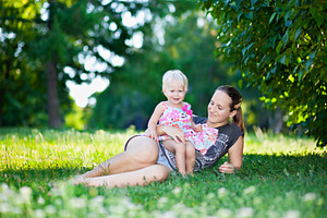 Baby and mother playing, a Photo by saiko3p