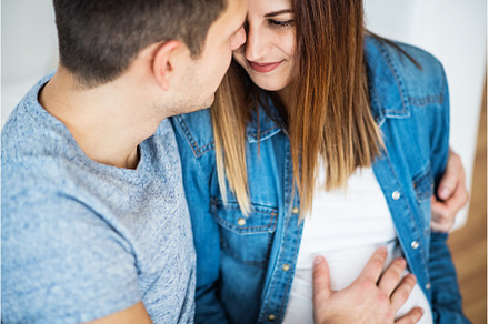 Pregnant woman and her partner, a Person Photo by HalfPoint