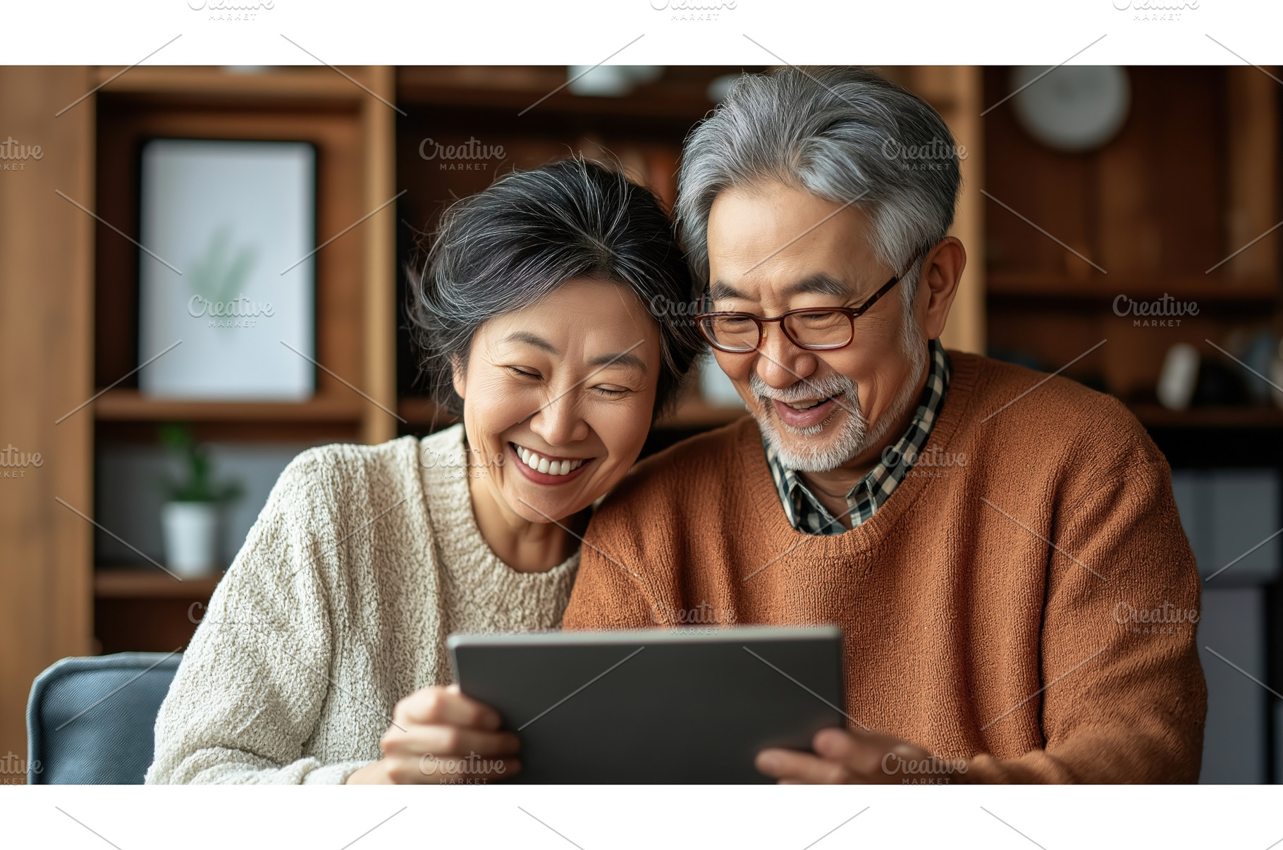 Asian senior couple smiling while, a Technology Photo by Sergey Kotenev