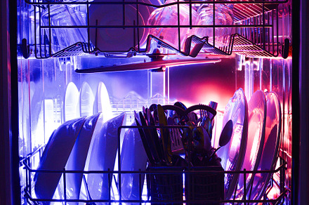 Interior of full dishwasher illuminated with blue and red backli, a Food & Drink Photo by Davizro's Market