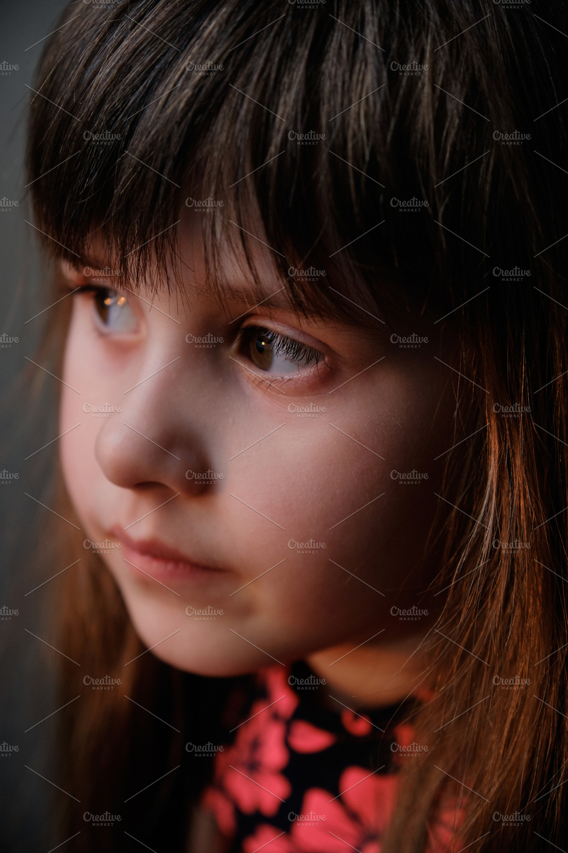 Softly lit portrait focusing on the child's delicate features and side view., a Person Photo by Rohan Photography