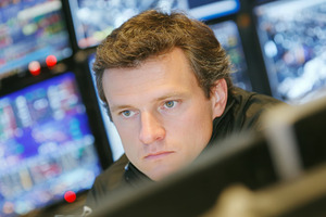 Focused trader monitoring stock market screens in a modern financial trading ro, a Photo by AS photostudio