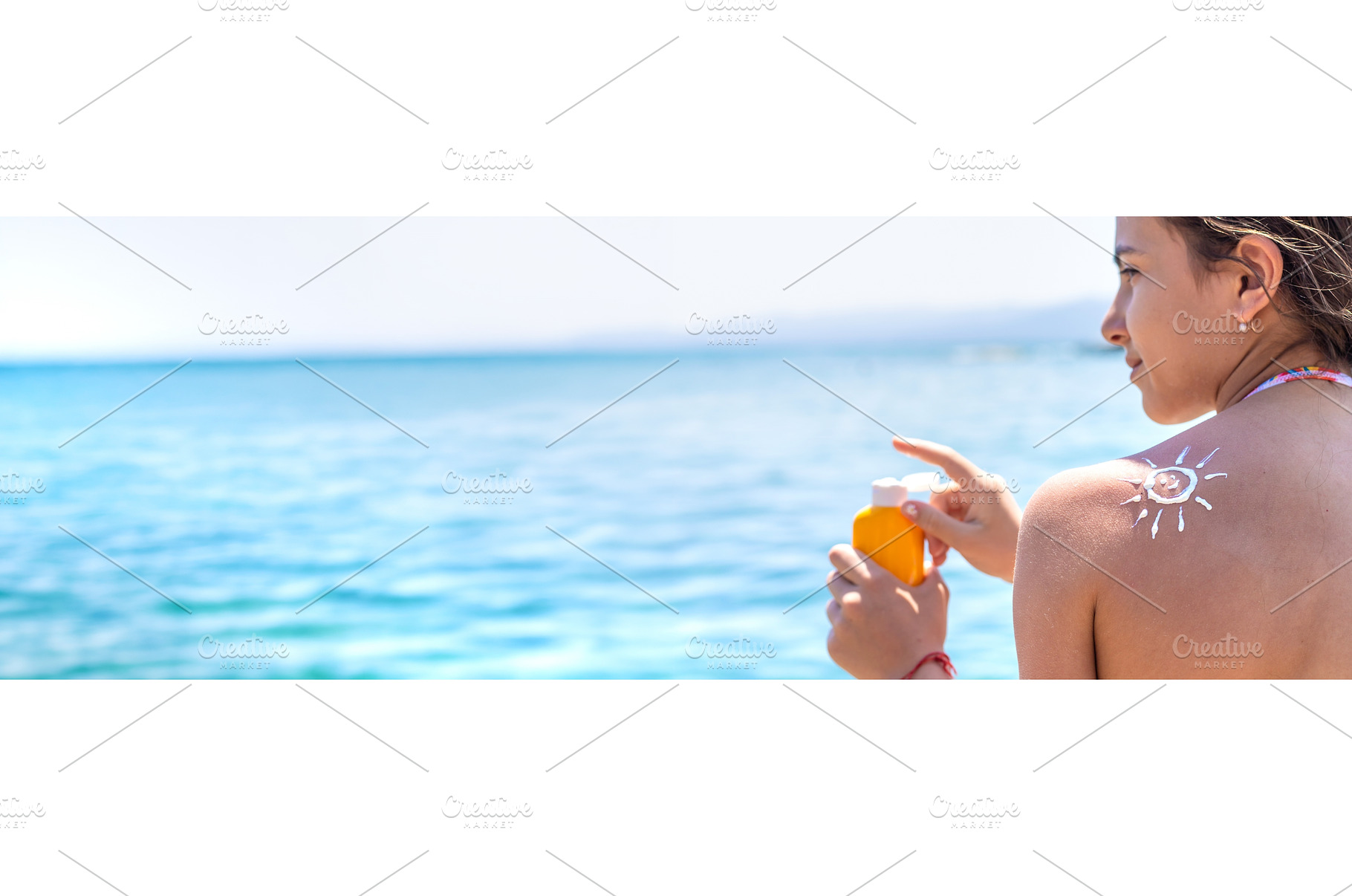 The child has sunscreen on his back, a Holiday Photo by yanadjana