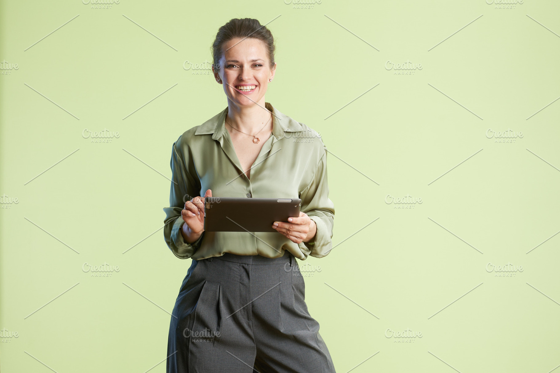 Smiling professional with tablet, a Person Photo by Alliance Images