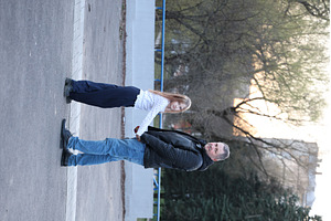 A father is walking with his, a Person Photo by Nenahliadava Design