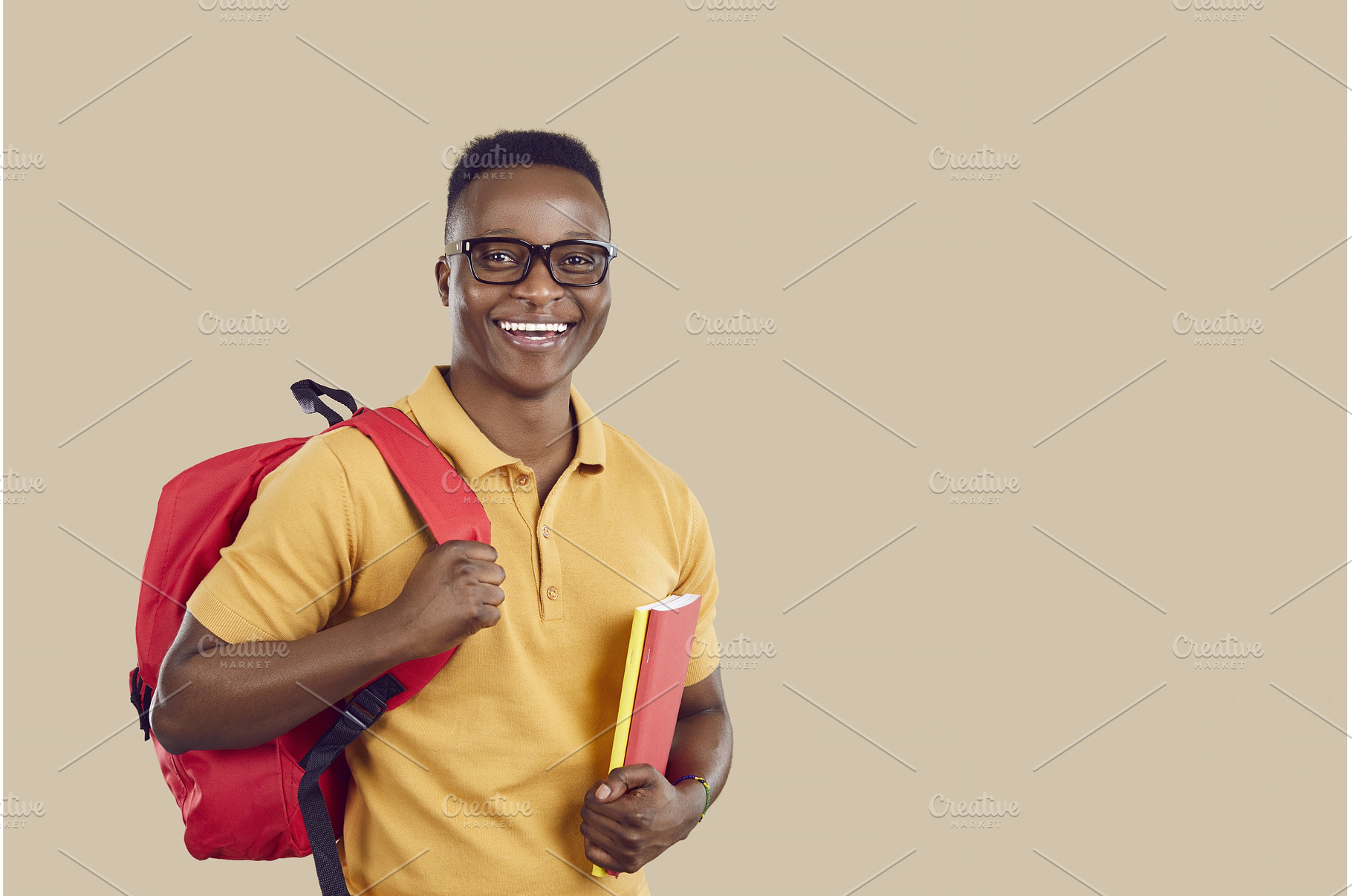 Happy African American student with, a Person Photo by StudioRomantic