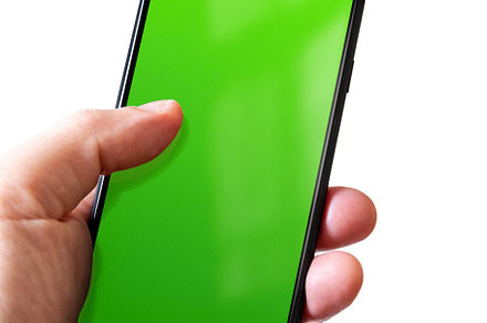 Hand holding a smartphone with blank green screen. Isolated on w, a Technology Photo by GoodGoods
