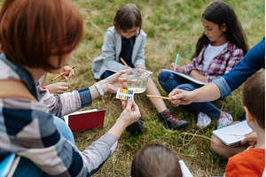Young students analyzing water, a Person Photo by HalfPoint