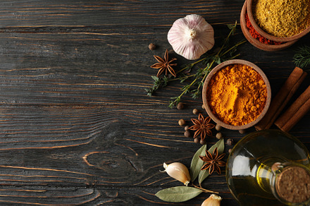 Bowls with spices and ingredients on wooden background, space fo, a Food & Drink Photo by AtlasStudio