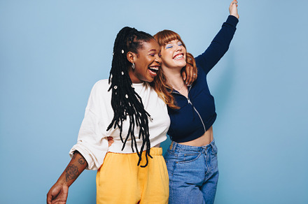 Two cheerful best friends laughing and having fun while embracin, a Person Photo by Jacob Lund