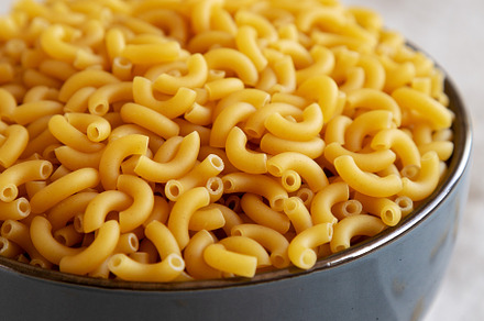 Bowl of Dry Organic Macaroni Elbow Pasta, Ready to be Cooked. Cl, a Food & Drink Photo by LiudmylaChuhunova