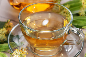 Linden tea cup and teapot brewing healthy drink, a Food & Drink Photo by Olena Rudo