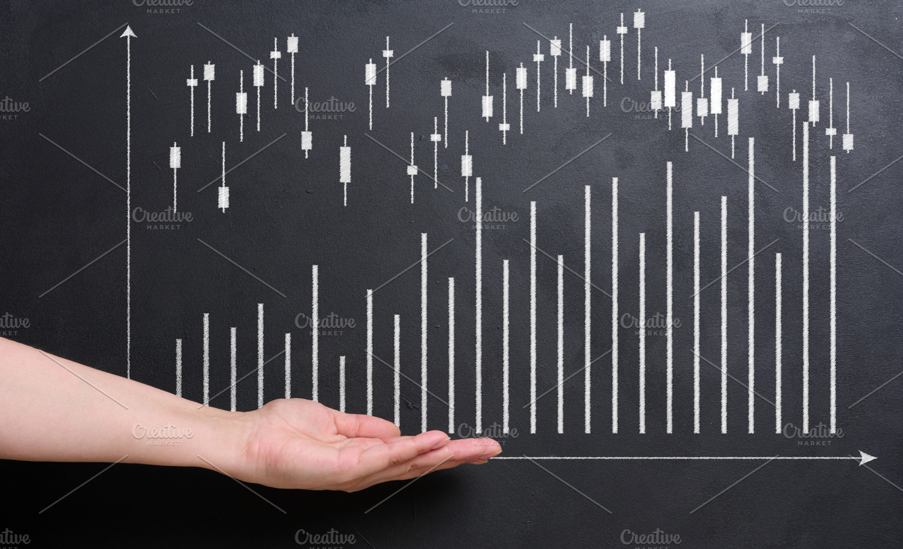 A hand reaches out towards a stock market chart drawn in white o, a Business Photo by ndanko