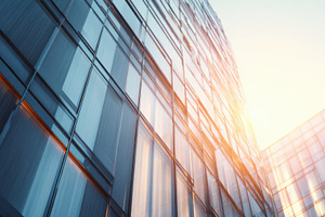 Glass buildings mirror sunlight, a Photo by Beautiful things