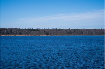 Blue sky over river on spring, a Nature Photo by Koldunova