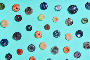 Colorful sewing buttons on bright, a Background Photo by Gladkov photography