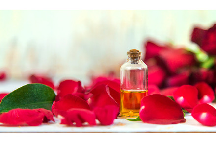 Rose essential oil in a small bottle, a Beauty & Fashion Photo by yanadjana