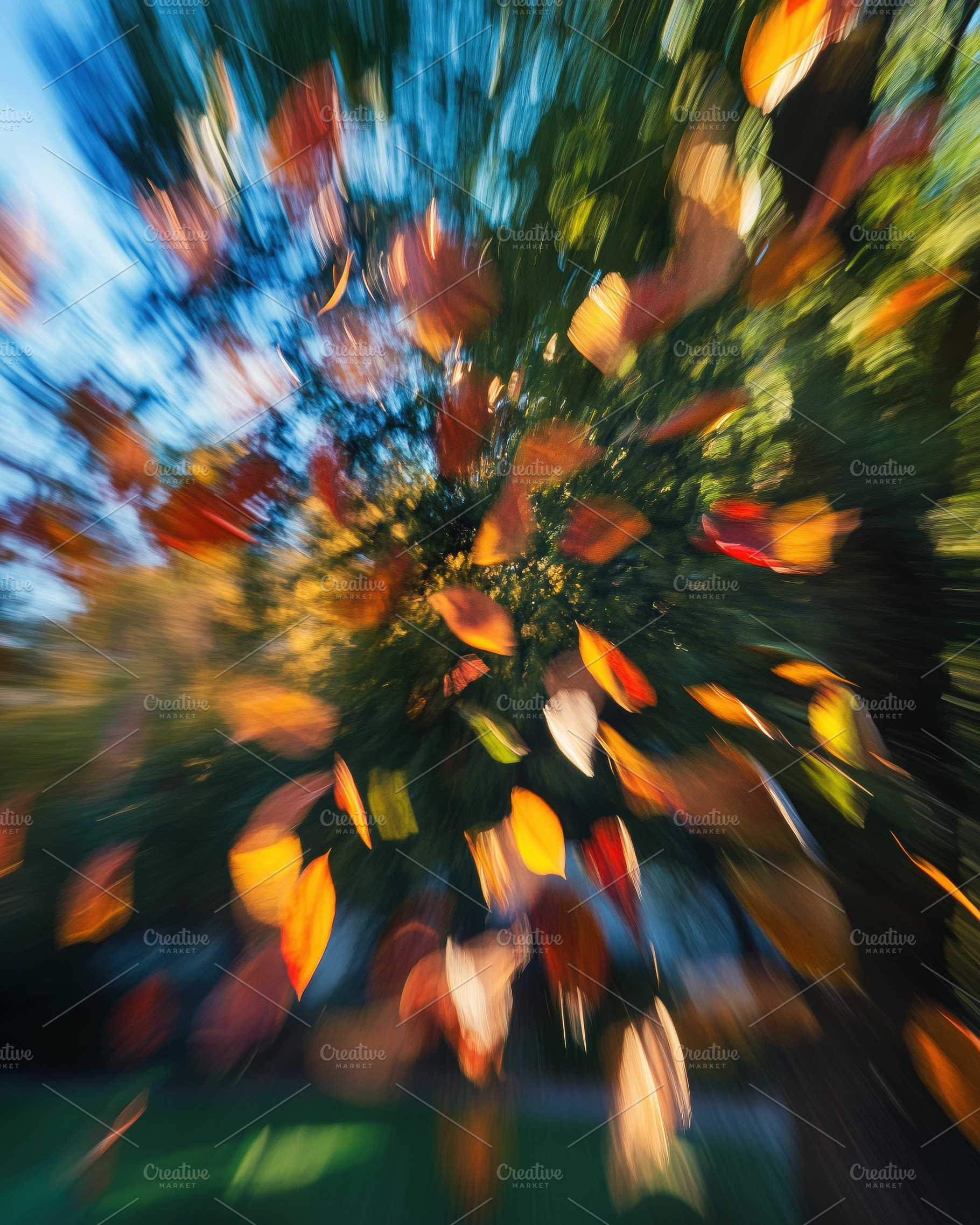 A dynamic, blurred image of autumn leaves swirling in the air, capturing the es, a Photo by Textures & Backgrounds