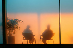 Silhouettes of conversation behind frosted glass, a Business Photo by AlyaAnd