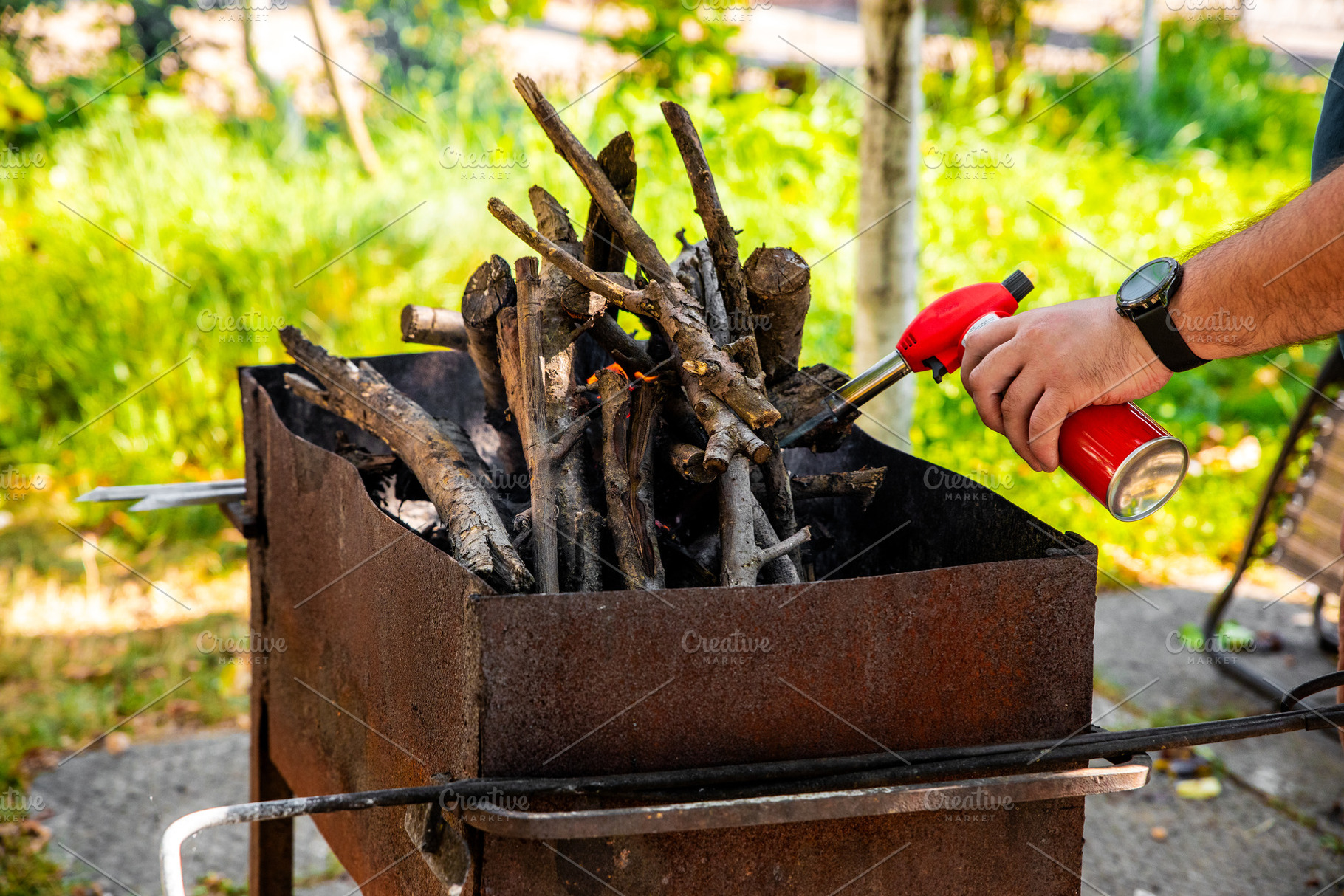 Lighting Outdoor Barbecue Grill, a Holiday Photo by Ales Munt