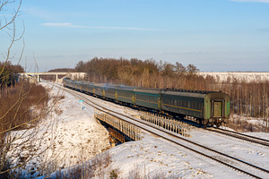 Passenger train during wintertime in Ukraine, a Transportation Photo by Leonid Andronov