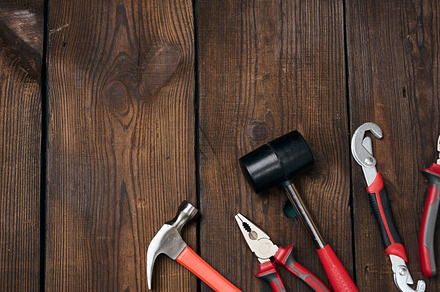 A set of construction tools on a brown wooden background, top vi, an Industrial Photo by ndanko