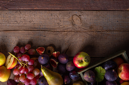 Autumn fruit assortment on wooden background, a Food & Drink Photo by Rimma