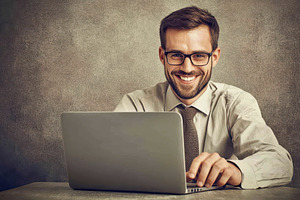 Professional man working on laptop w, a Photo by Tanuart