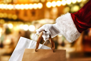 Santa Claus holding shopping bags for shopping shops in backgrou, a Person Photo by Davizro's Market