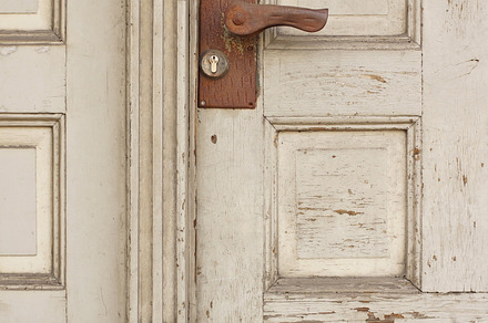 Old door containing wood, door, and house