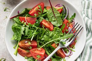 Fresh green salad with tomatoes and microgreens, a Food & Drink Photo by Olena Rudo