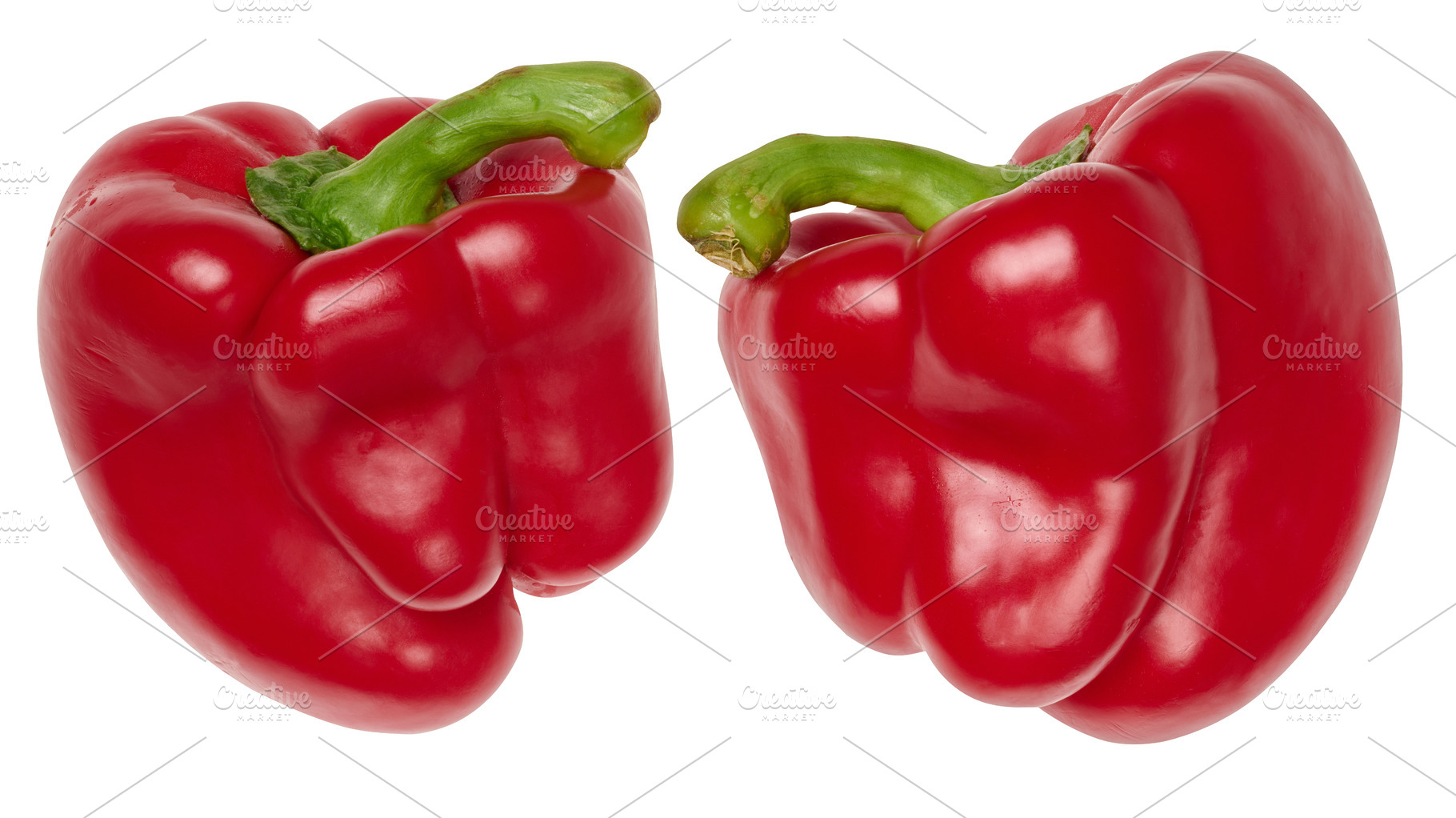 Two ripe red bell peppers with green stems, isolated background, a Food & Drink Photo by ndanko