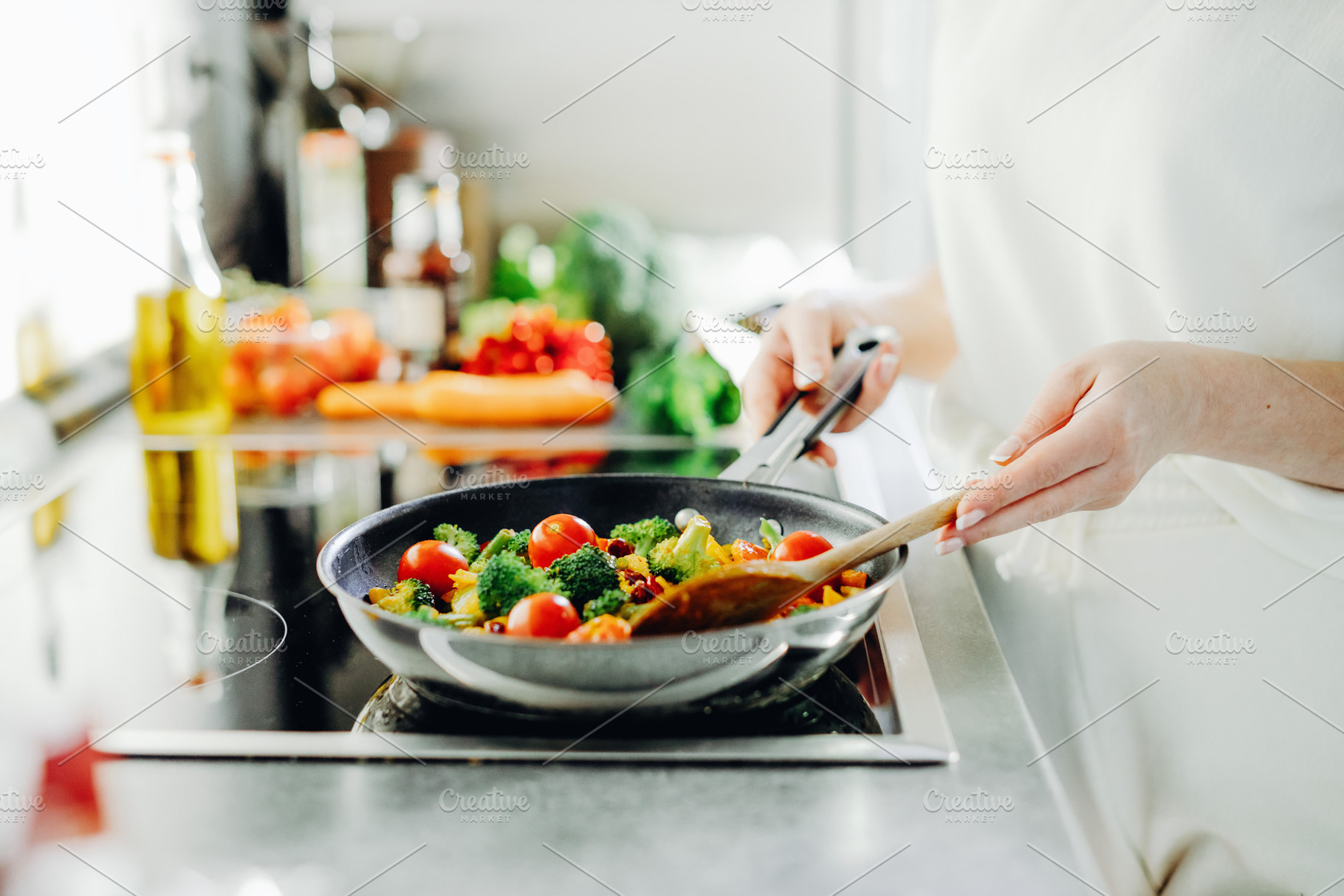 Woman cooking vegetables on pan, a Food & Drink Photo by Valeria Art