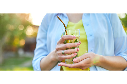 Woman drinking summer citrus, a Food & Drink Photo by IlliaBondarPhotography