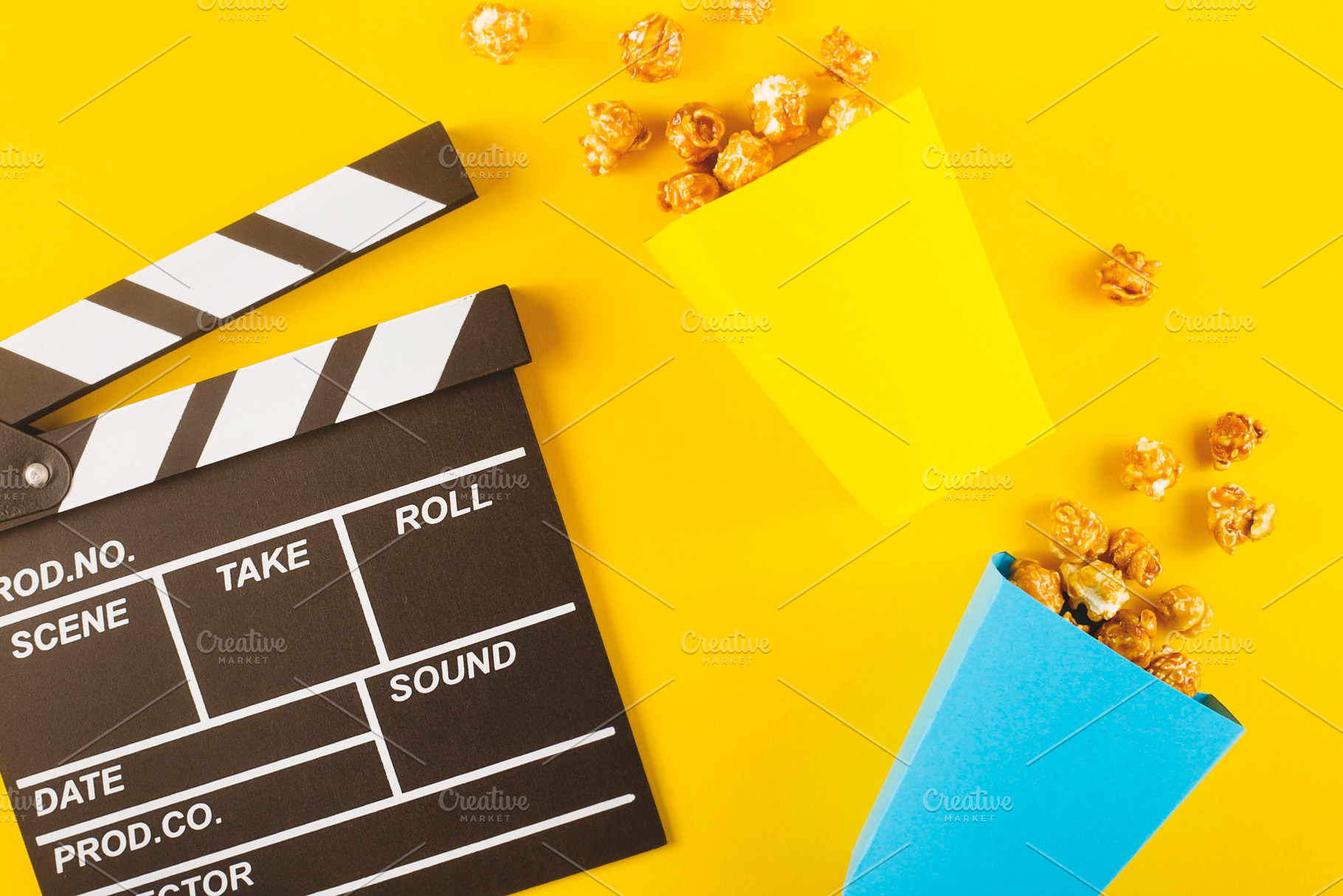 Popcorn and clapperboard on yellow, an Arts & Entertainment Photo by Valeriia • Svitlini