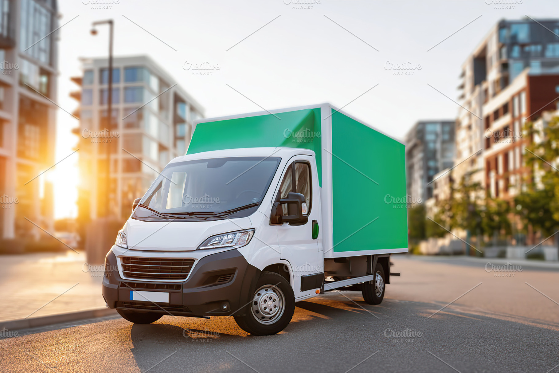 Delivery truck parked in urban area during sunset with modern buildings in back, an Industrial Photo by AlyaAnd