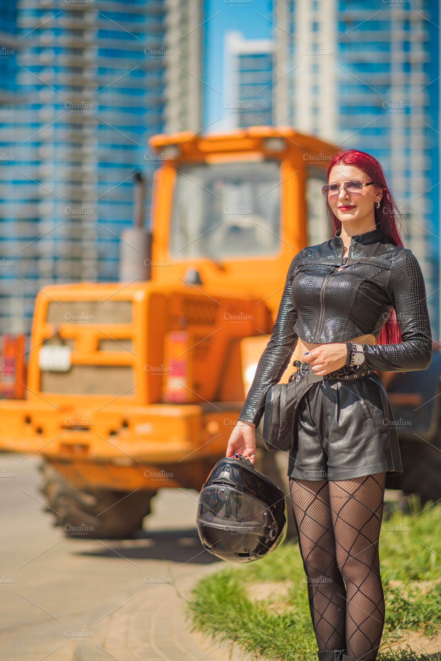 Smiling red haired woman with motorcycle helmet standing near or, a Photo by Pictures for you!!!!!!!!!