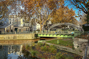 Autumn bridge view over canal Saint Martin in Paris, France, an Architecture Photo by GoodGoods