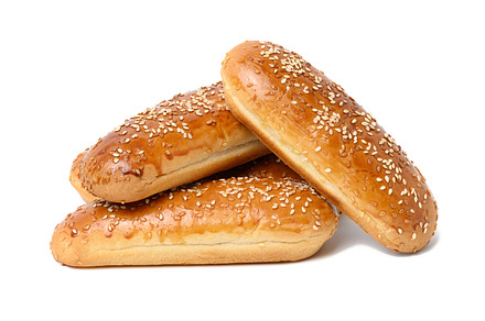 baked oblong sesame hot dog bun isolated on white background, a Food & Drink Photo by ndanko