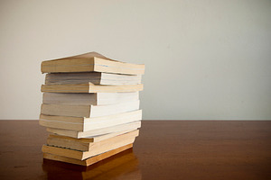 Book Stack on Table, a School & Education Photo by THP Creative